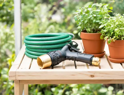 Durable hose nozzle and brass connector on a garden bench