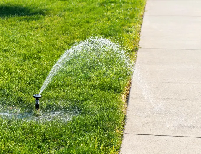Sprinkler pattern adjusted along a narrow lawn strip